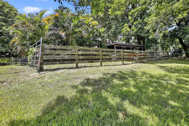 a view of bench sitting in a yard