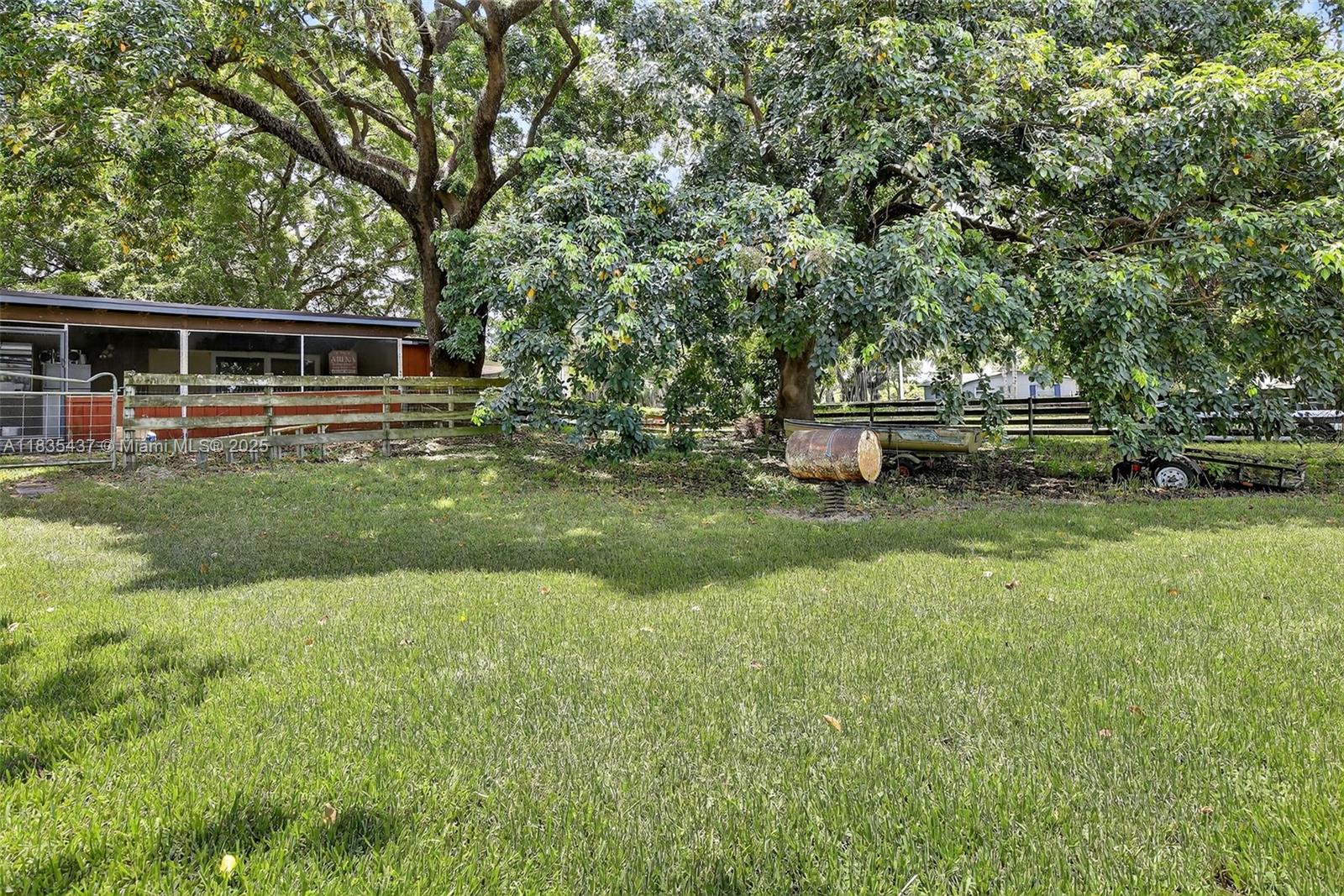 13851 Southwest 26th Street Davie, FL 33325 - Photo 24 of 48 a view of a house with a yard