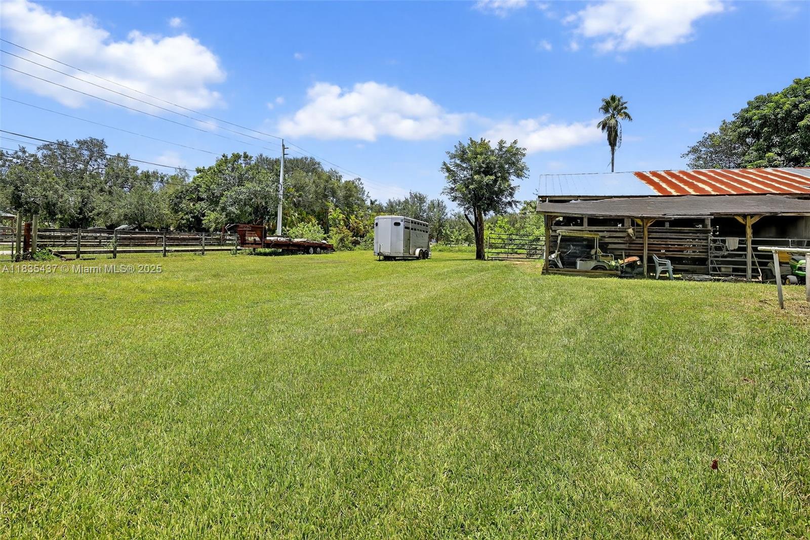 13851 Southwest 26th Street Davie, FL 33325 - Photo 25 of 48 a view of a house with a big yard