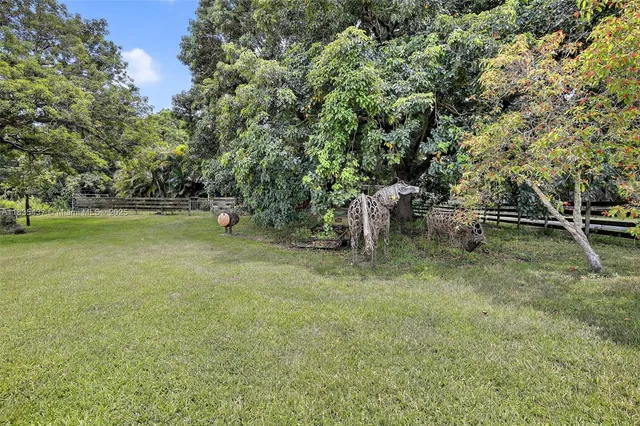 a view of outdoor space with deck and yard