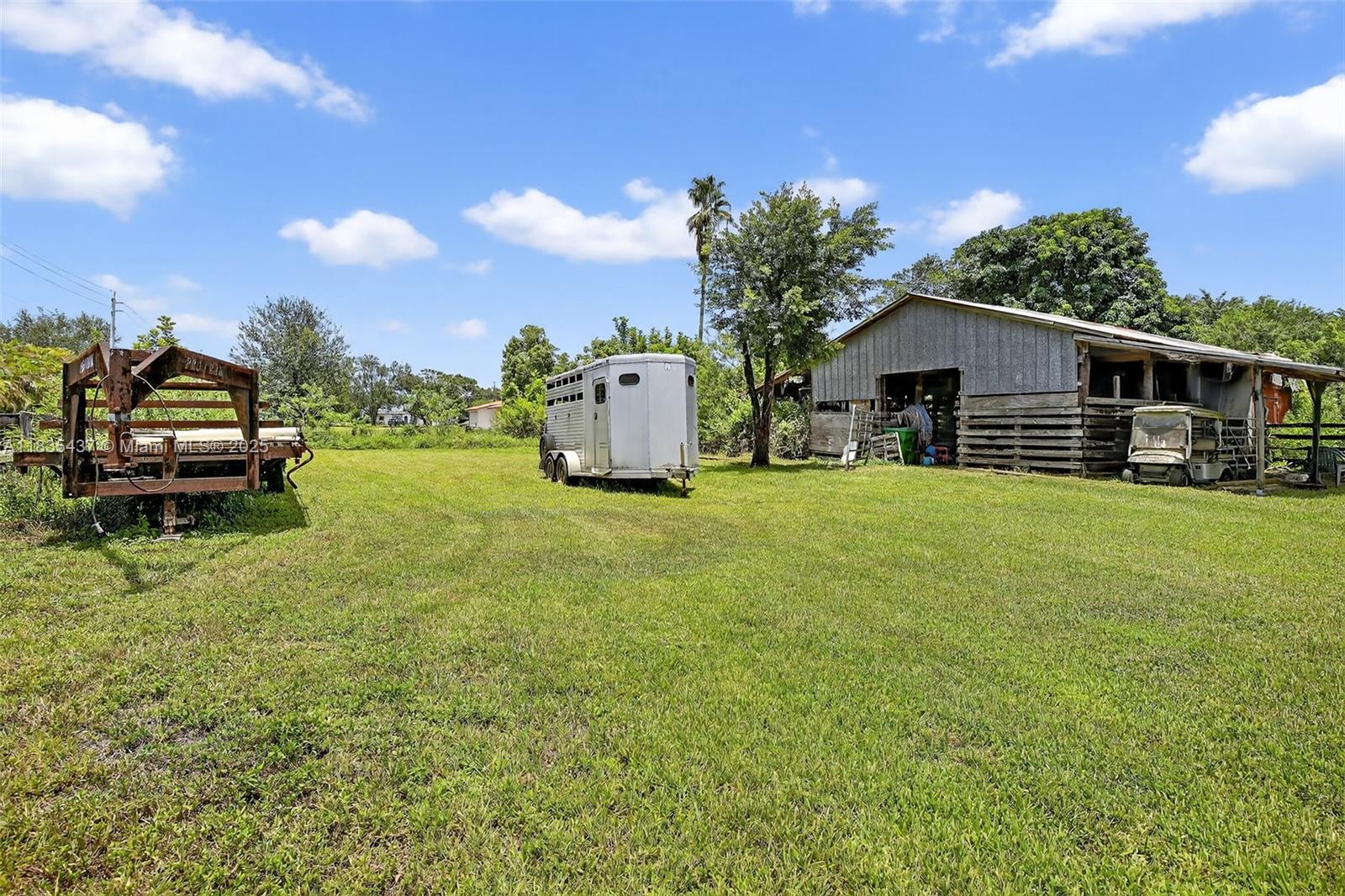 13851 Southwest 26th Street Davie, FL 33325 - Photo 28 of 48 a view of a house with a yard and sitting area