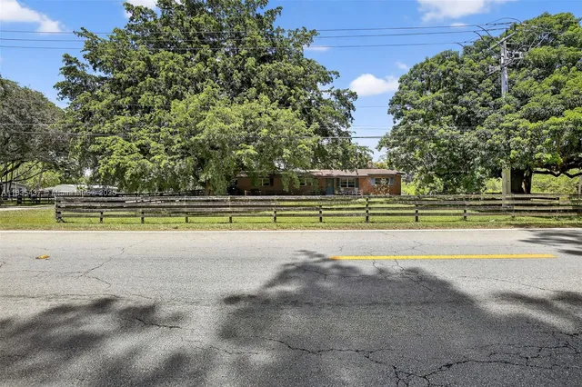 a view of a swimming pool with an outdoor space and seating area
