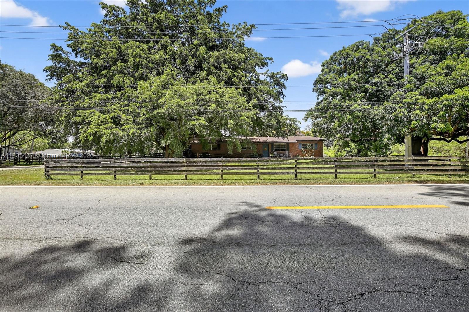 13851 Southwest 26th Street Davie, FL 33325 - Photo 32 of 48 a view of a swimming pool with an outdoor space and seating area