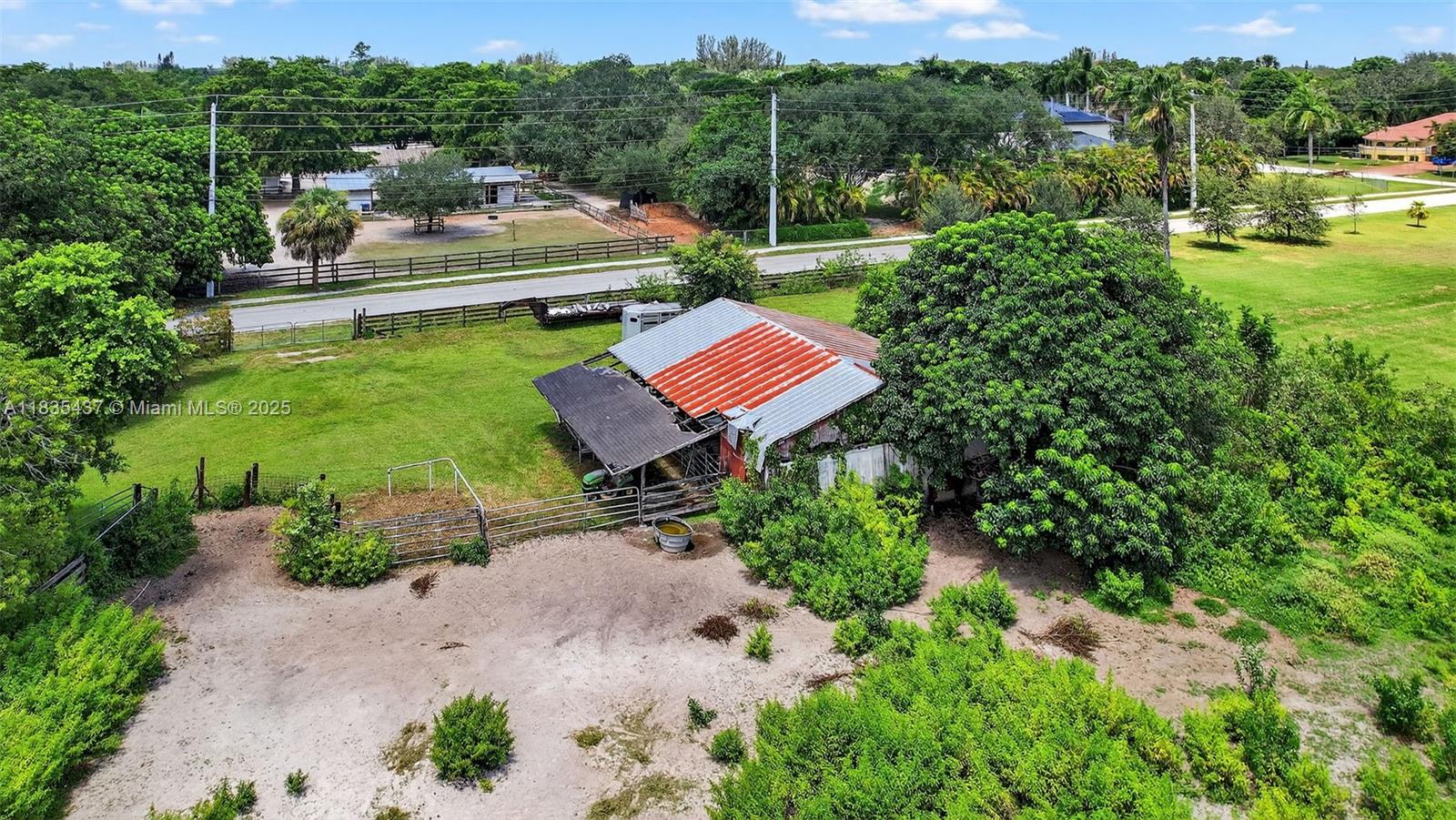 13851 Southwest 26th Street Davie, FL 33325 - Photo 42 of 48 a backyard of a house with a yard and outdoor seating