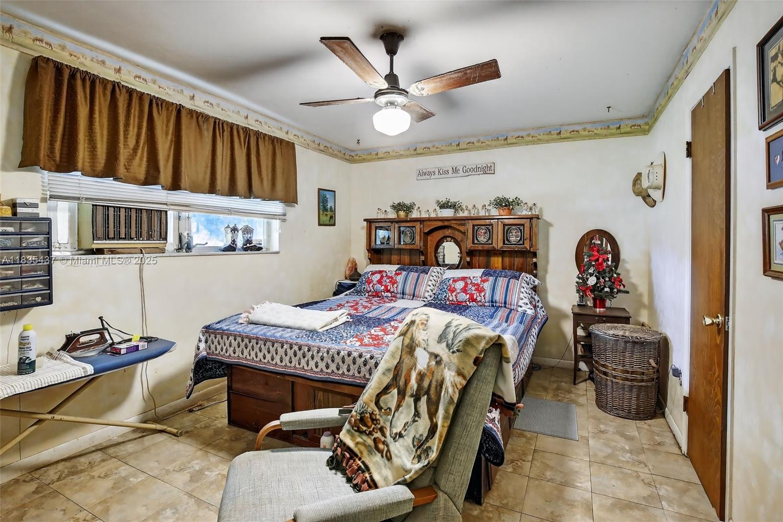 13851 Southwest 26th Street Davie, FL 33325 - Photo 9 of 48 a bedroom with a bed and a chandelier