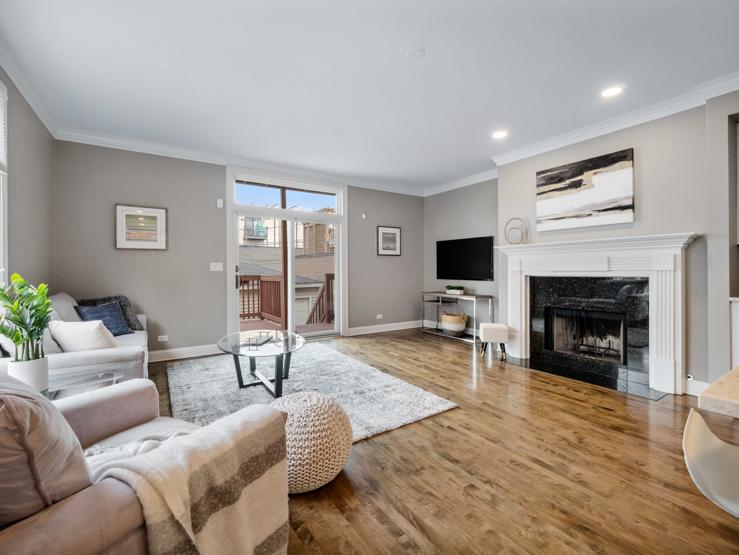2452 West Dakin Street Chicago, IL 60618 - Photo 20 of 39 a living room with furniture a flat screen tv and a fireplace