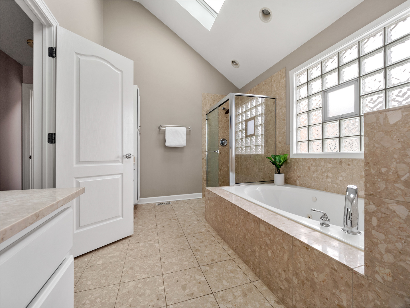 2452 West Dakin Street Chicago, IL 60618 - Photo 26 of 39 a bathroom with a bathtub and a sink