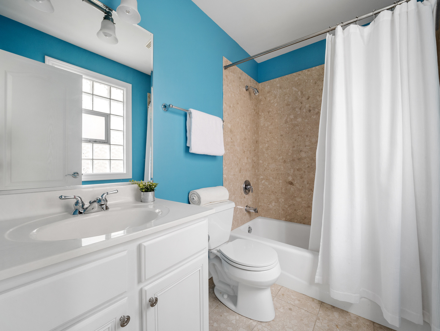 2452 West Dakin Street Chicago, IL 60618 - Photo 27 of 39 a bathroom with a sink a toilet and a bathtub
