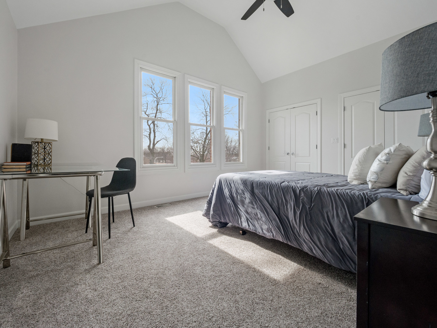 2452 West Dakin Street Chicago, IL 60618 - Photo 30 of 39 a bedroom with a bed and a chandelier