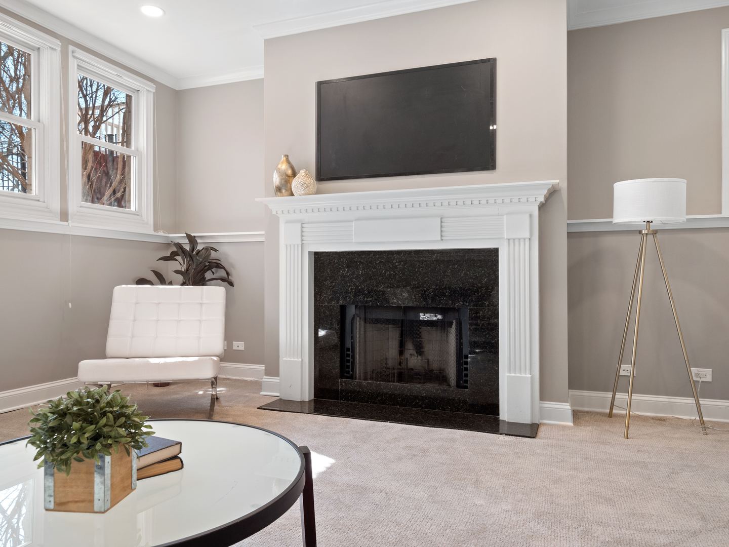 2452 West Dakin Street Chicago, IL 60618 - Photo 37 of 39 a living room with furniture a flat screen tv and a fireplace