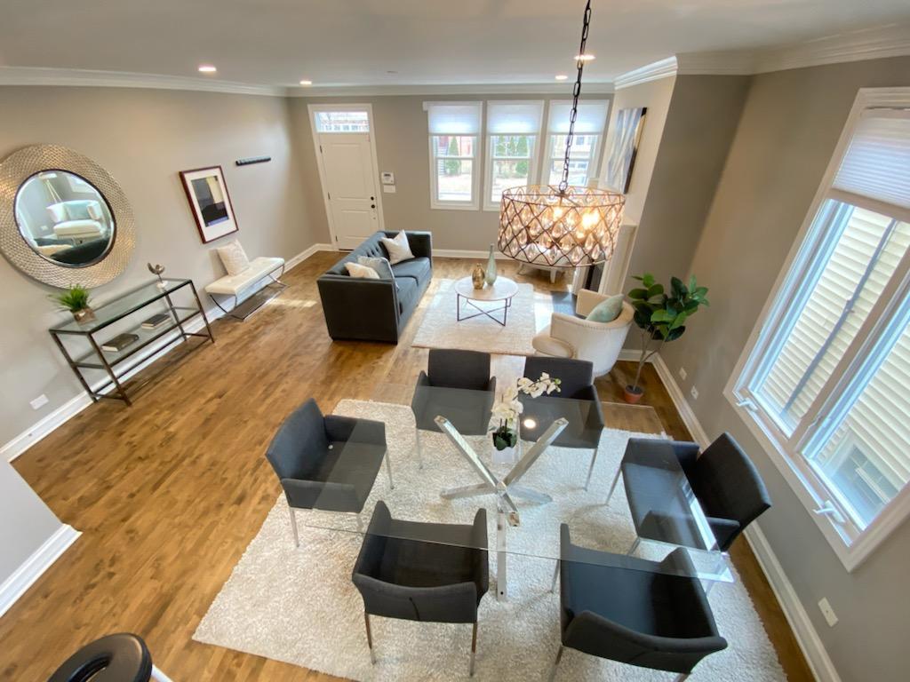 2452 West Dakin Street Chicago, IL 60618 - Photo 9 of 39 a view of a livingroom with furniture and a floor to ceiling window