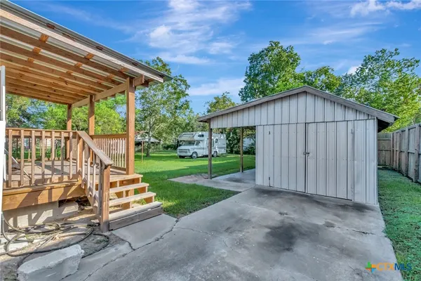 a view of backyard with green space