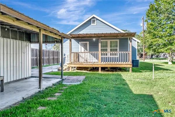 a house with garden in front of it