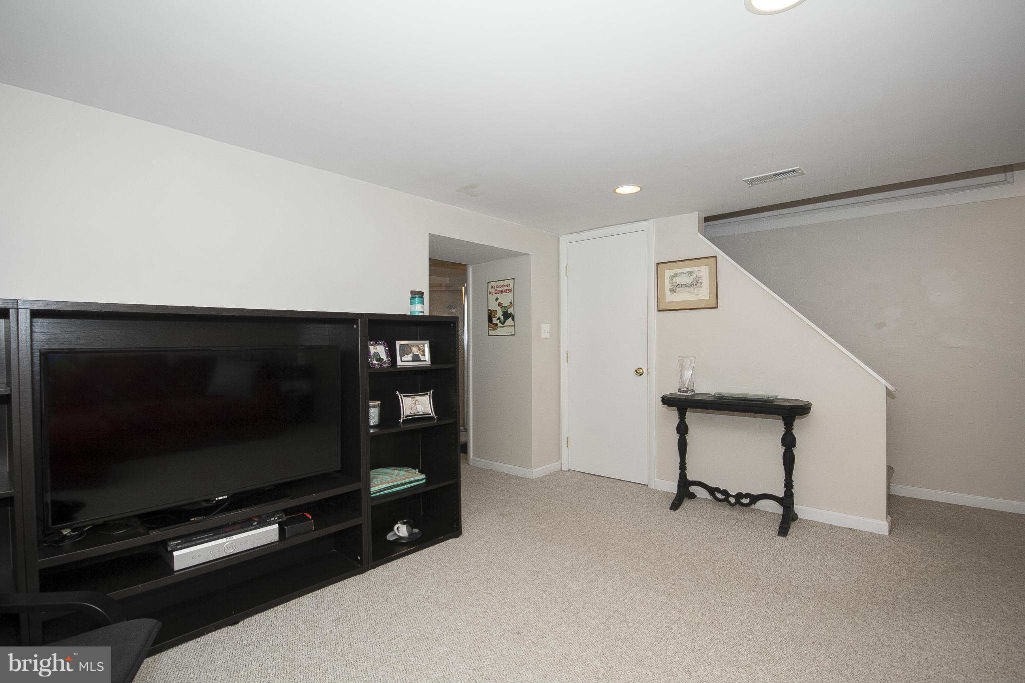 8616 Black Oak Road Baltimore, MD 21234 - Photo 11 of 21 a room with furniture and a flat screen tv