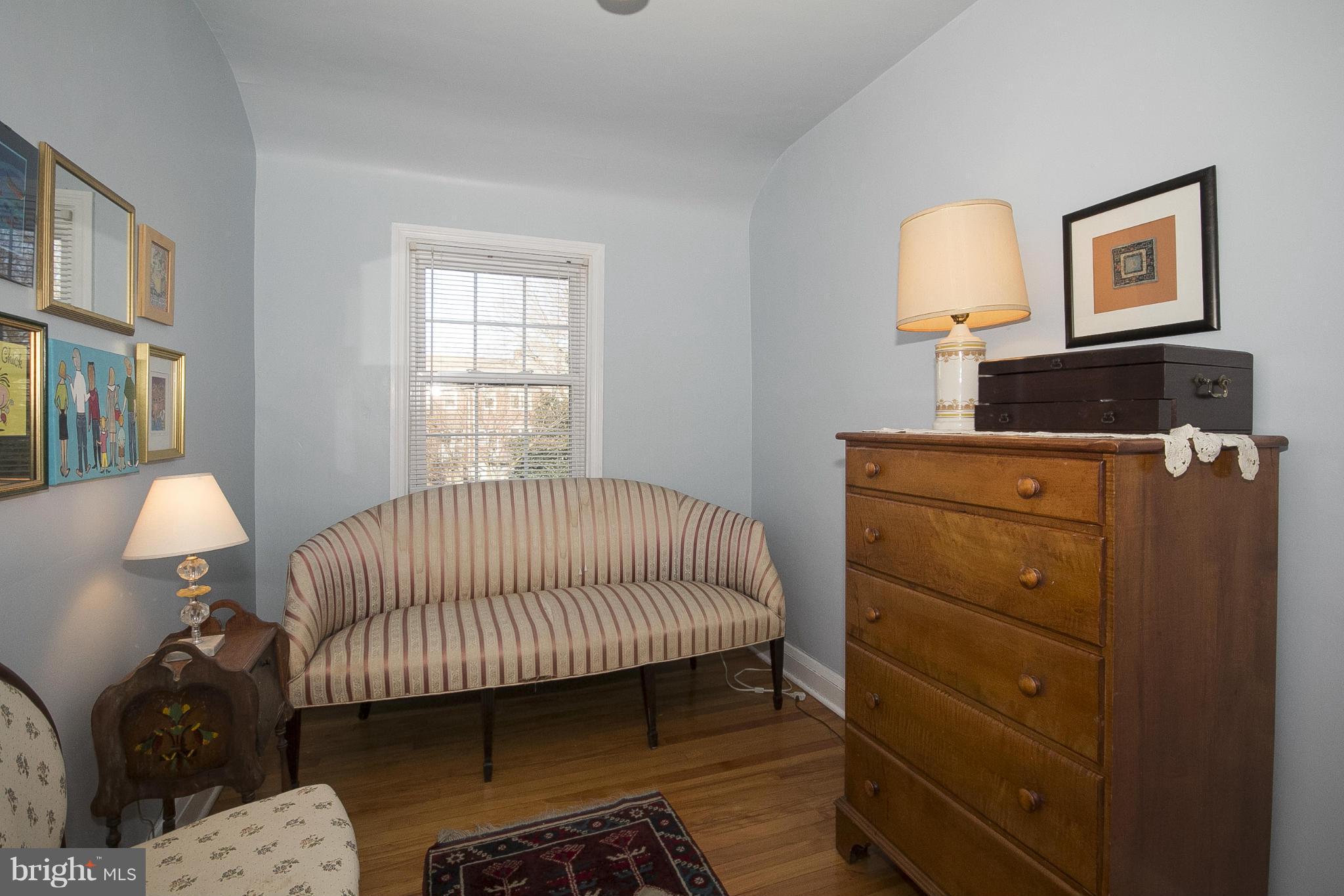8616 Black Oak Road Baltimore, MD 21234 - Photo 14 of 21 a bedroom with a bed and wooden floor