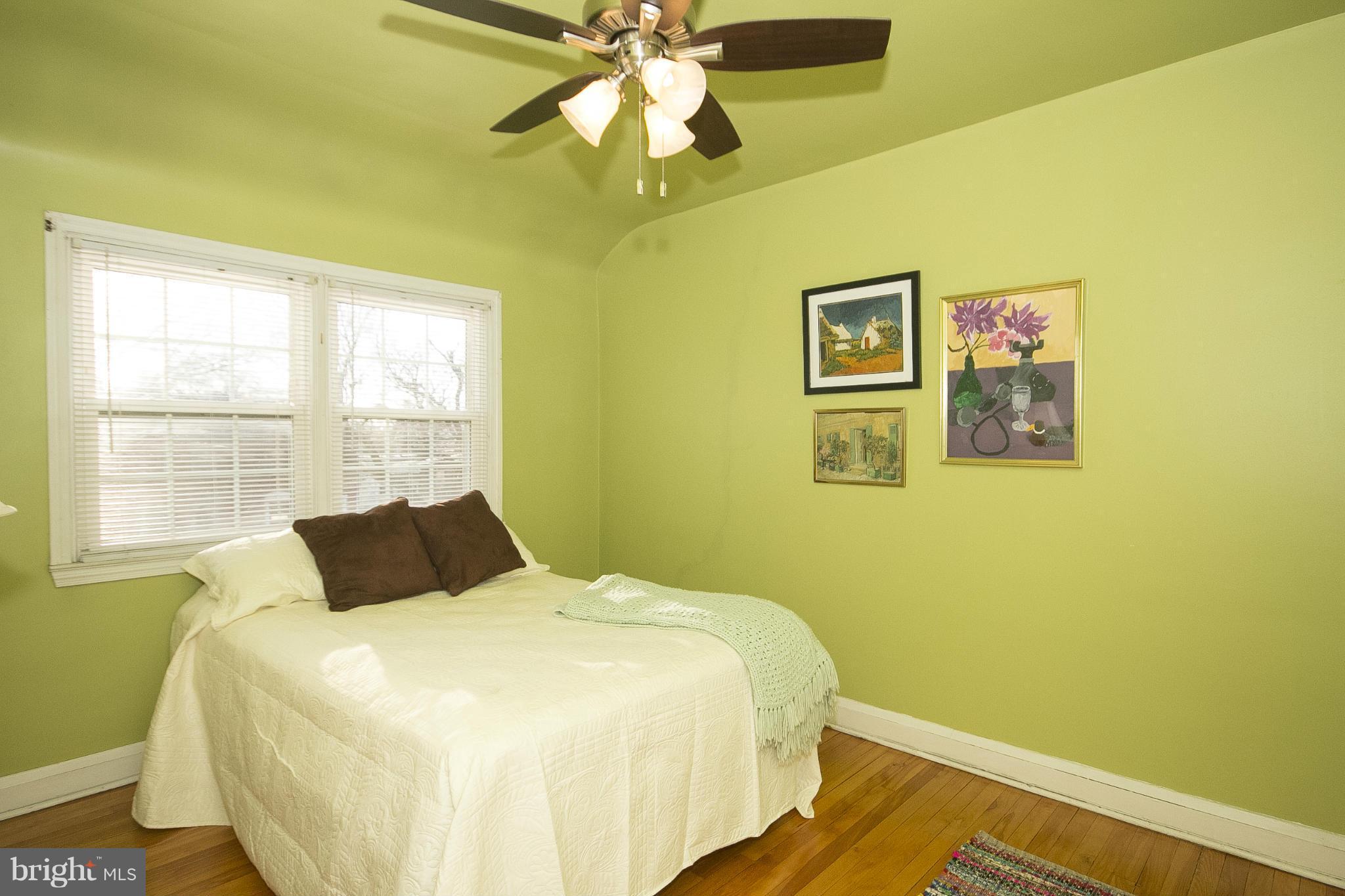8616 Black Oak Road Baltimore, MD 21234 - Photo 17 of 21 a bedroom with a bed and a window