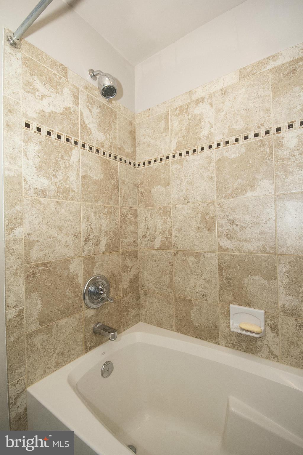 8616 Black Oak Road Baltimore, MD 21234 - Photo 20 of 21 a bathroom with a bathtub and shower