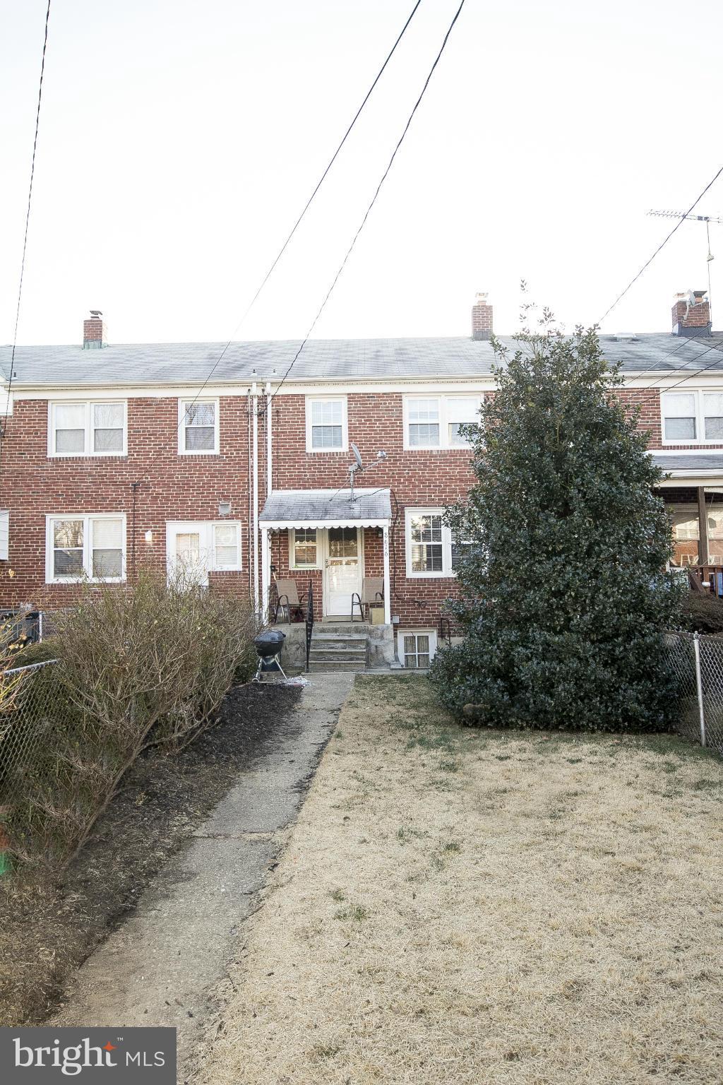 8616 Black Oak Road Baltimore, MD 21234 - Photo 21 of 21 a front view of a residential apartment building with a yard