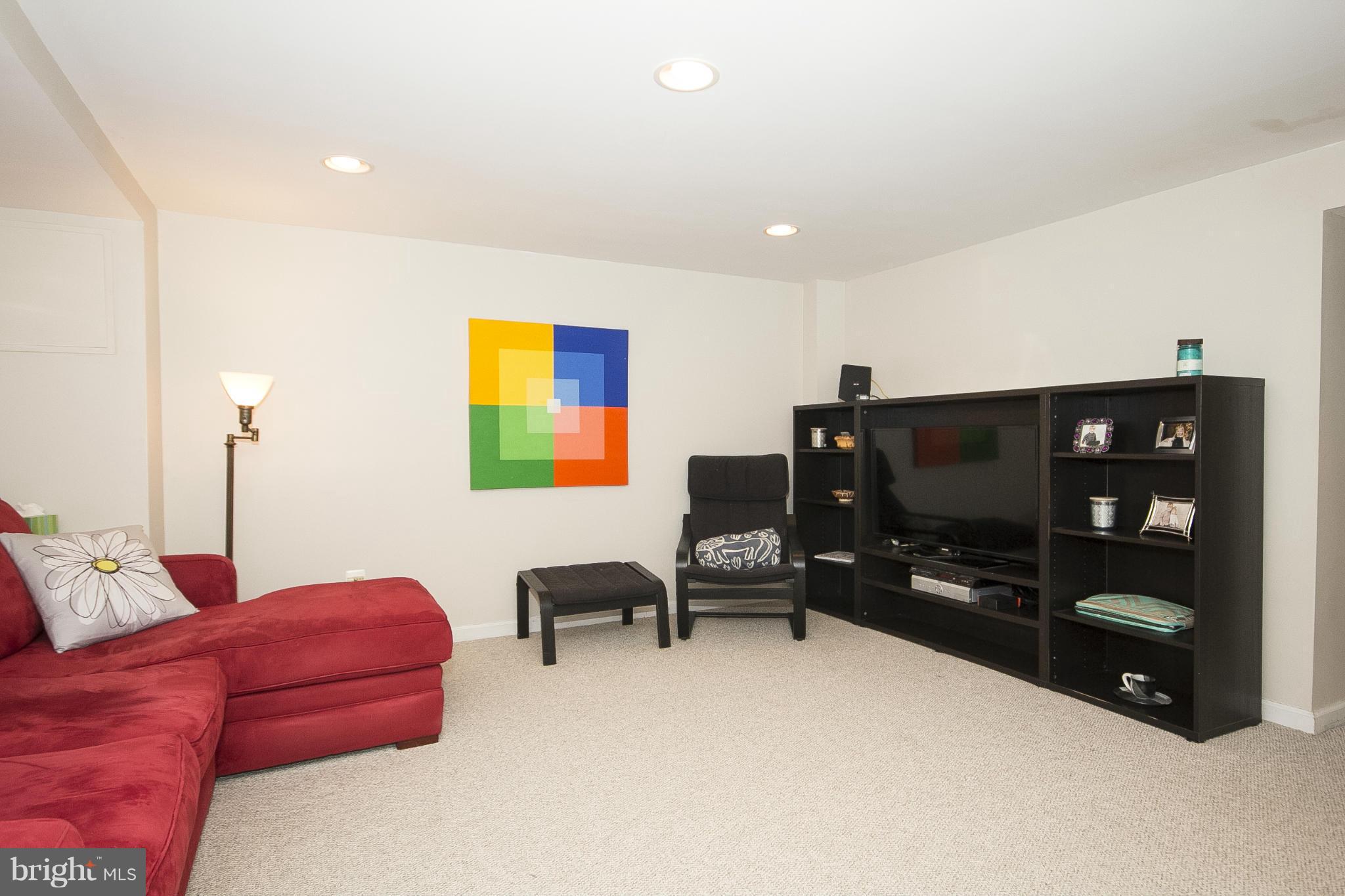8616 Black Oak Road Baltimore, MD 21234 - Photo 9 of 21 a bedroom with furniture and a flat screen tv