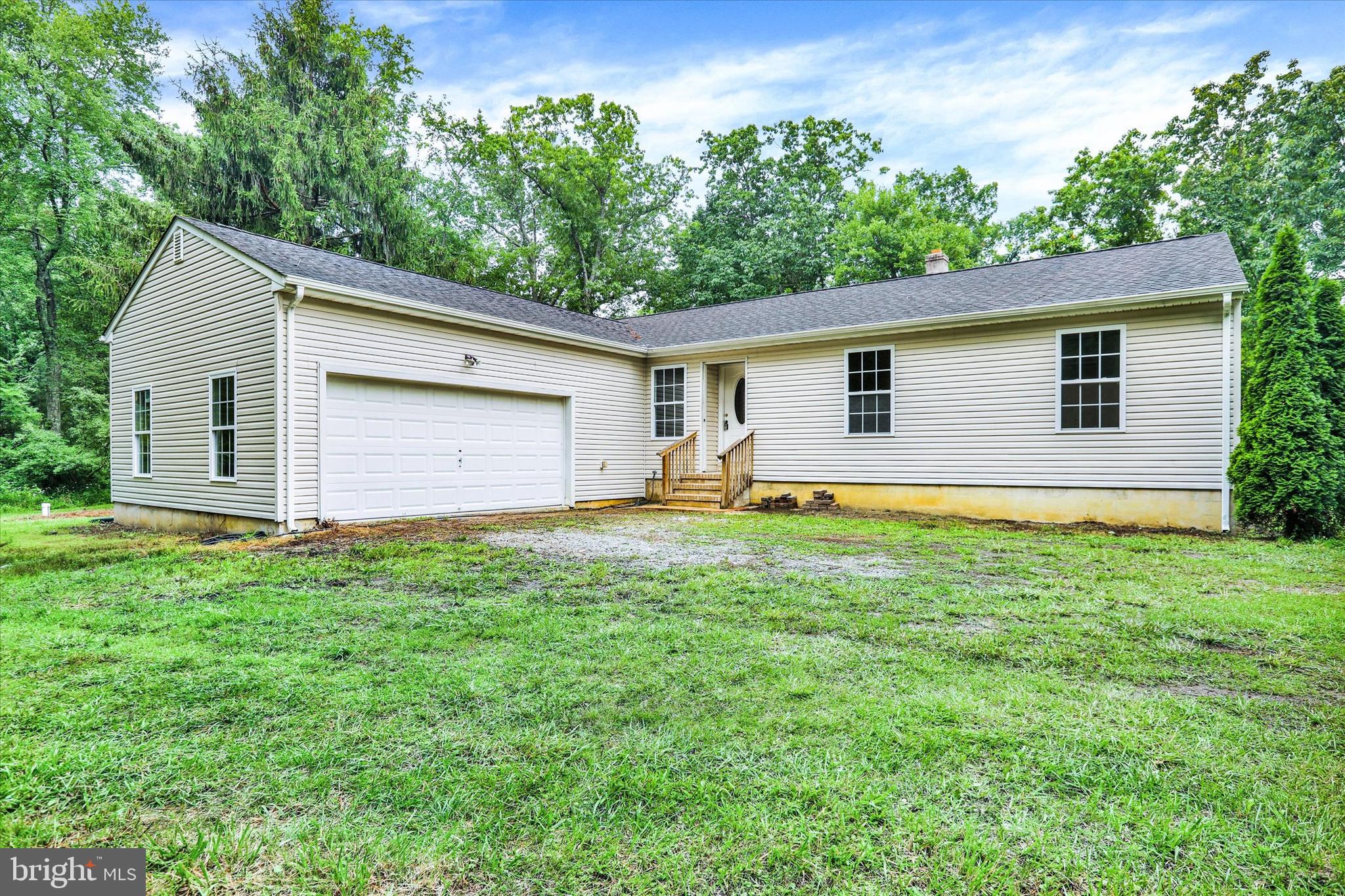 77 Hockamick Road Cookstown, NJ 08511 - Photo 1 of 25 a house view with a backyard space