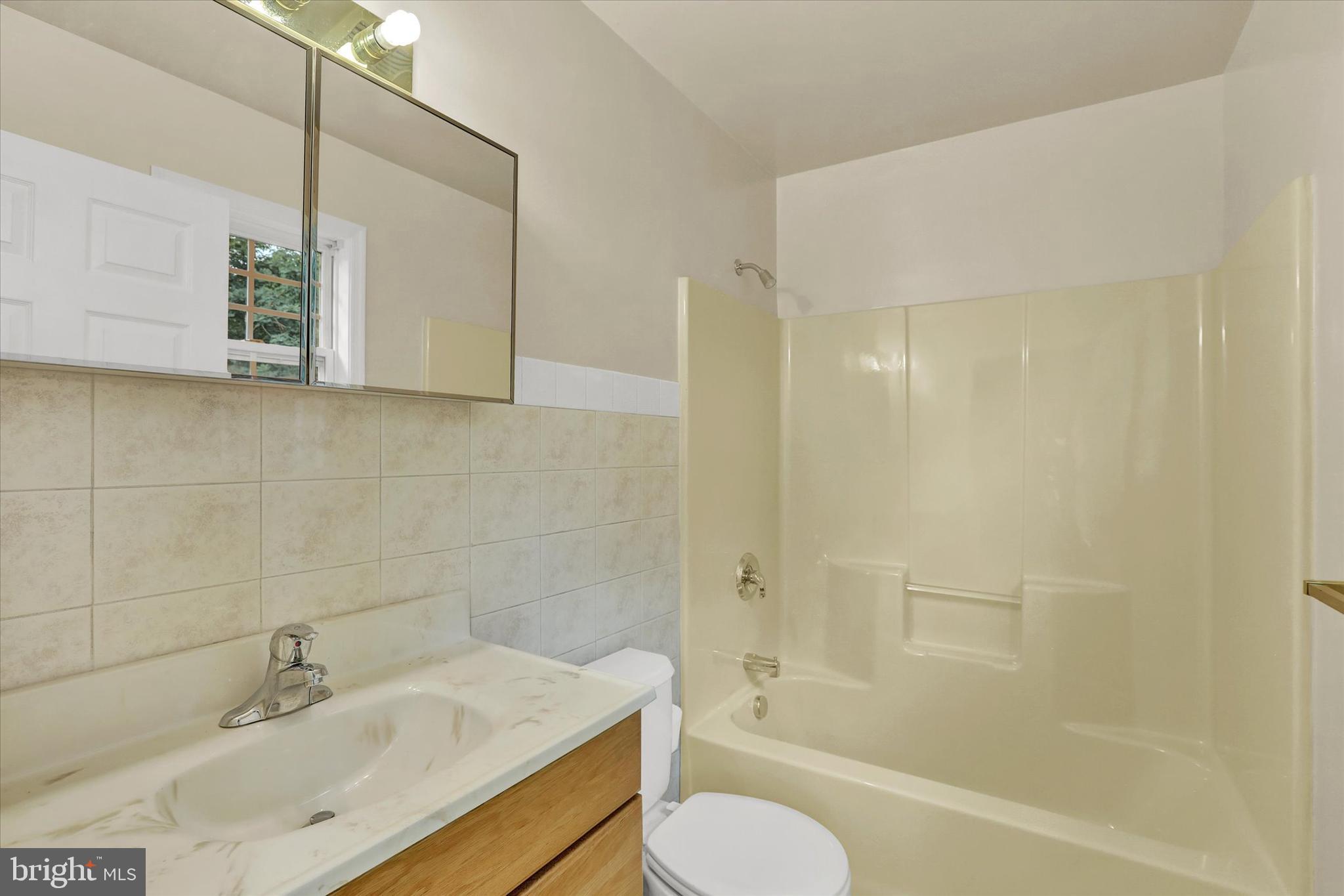 77 Hockamick Road Cookstown, NJ 08511 - Photo 15 of 25 a bathroom with a sink toilet and shower