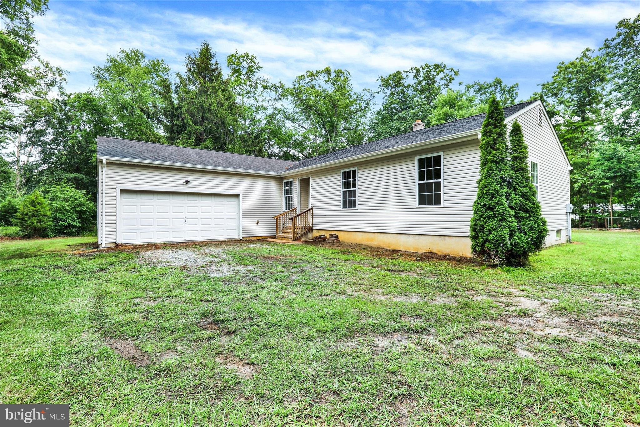 77 Hockamick Road Cookstown, NJ 08511 - Photo 2 of 25 a house view with a backyard space