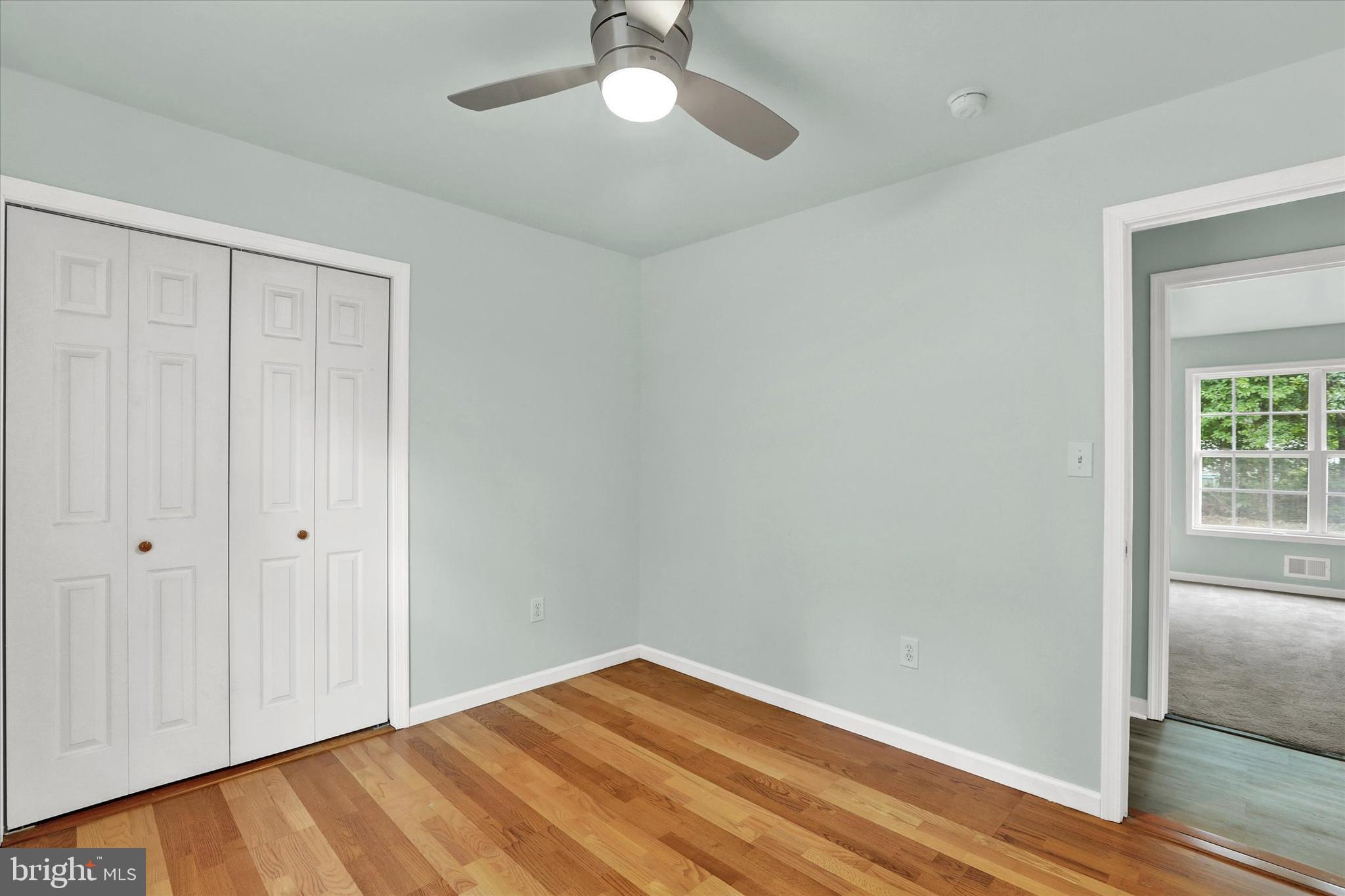 77 Hockamick Road Cookstown, NJ 08511 - Photo 21 of 25 wooden floor in an empty room with a window