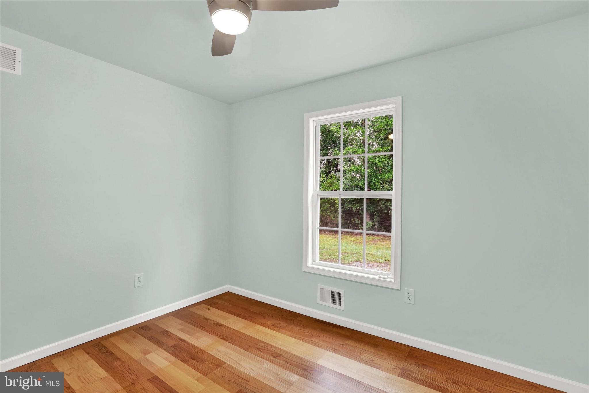 77 Hockamick Road Cookstown, NJ 08511 - Photo 22 of 25 a view of an empty room with wooden floor and a window