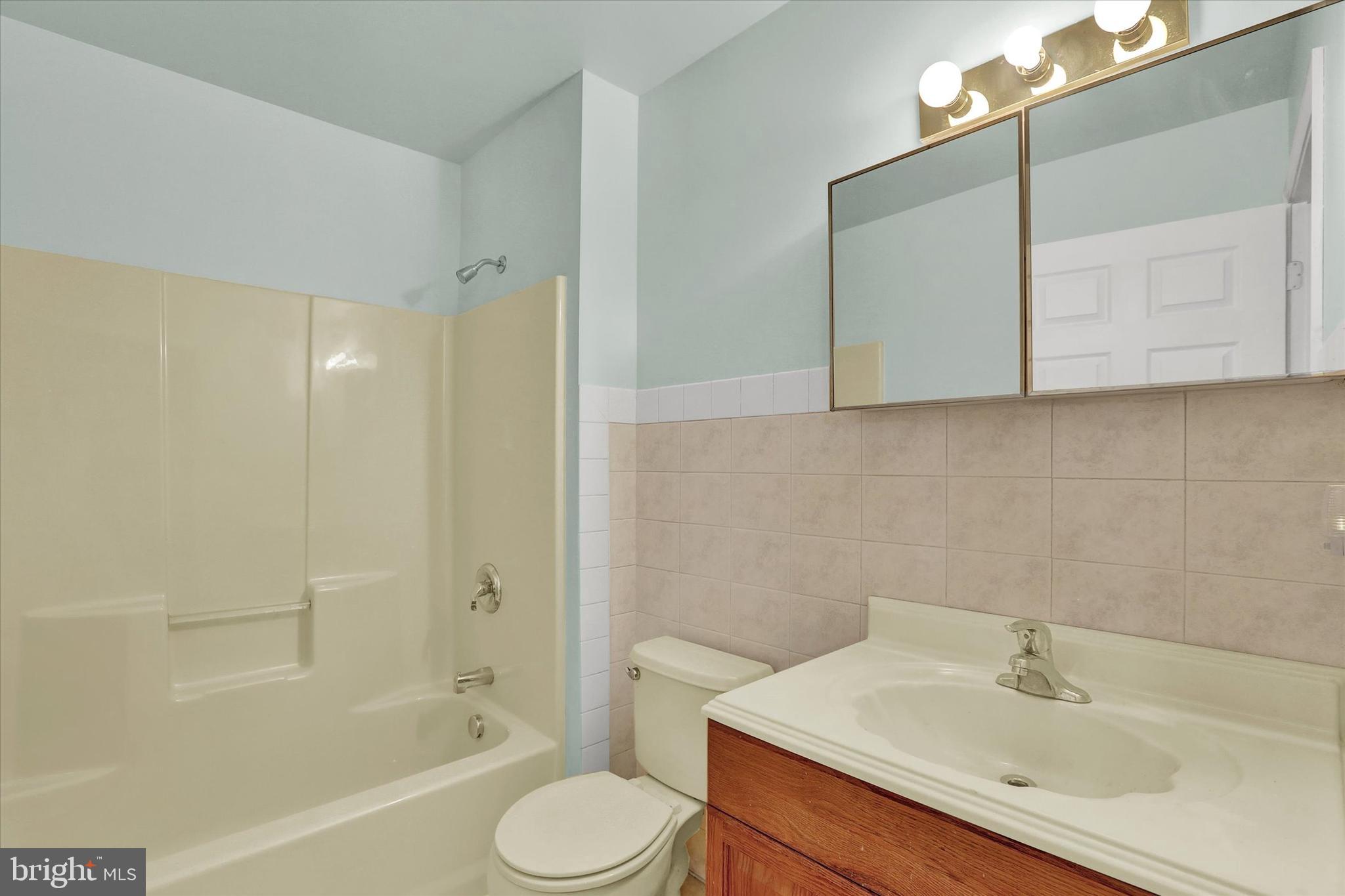 77 Hockamick Road Cookstown, NJ 08511 - Photo 23 of 25 a bathroom with a sink toilet and shower