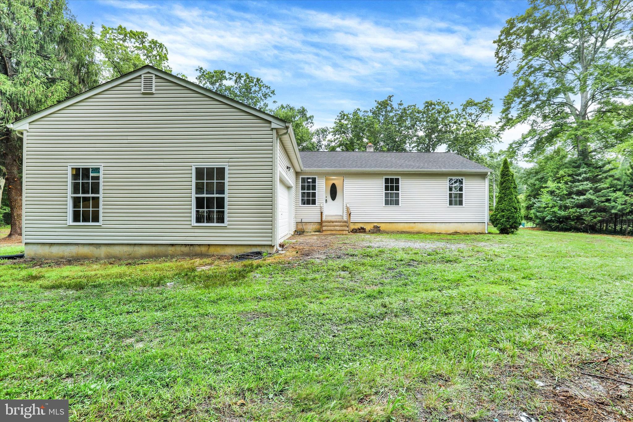 77 Hockamick Road Cookstown, NJ 08511 - Photo 25 of 25 a front view of house with yard and trees