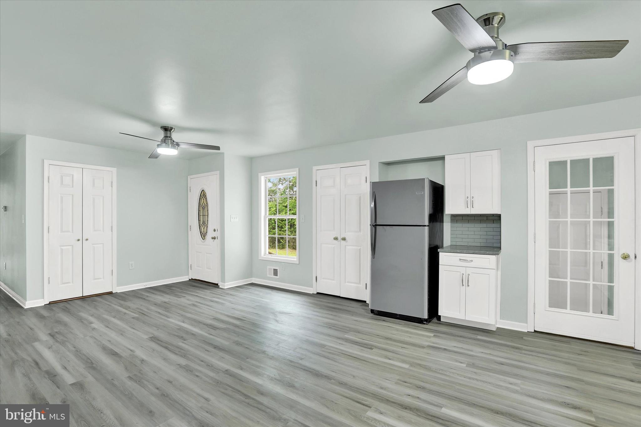 77 Hockamick Road Cookstown, NJ 08511 - Photo 6 of 25 a view of an empty room with a window and wooden floor