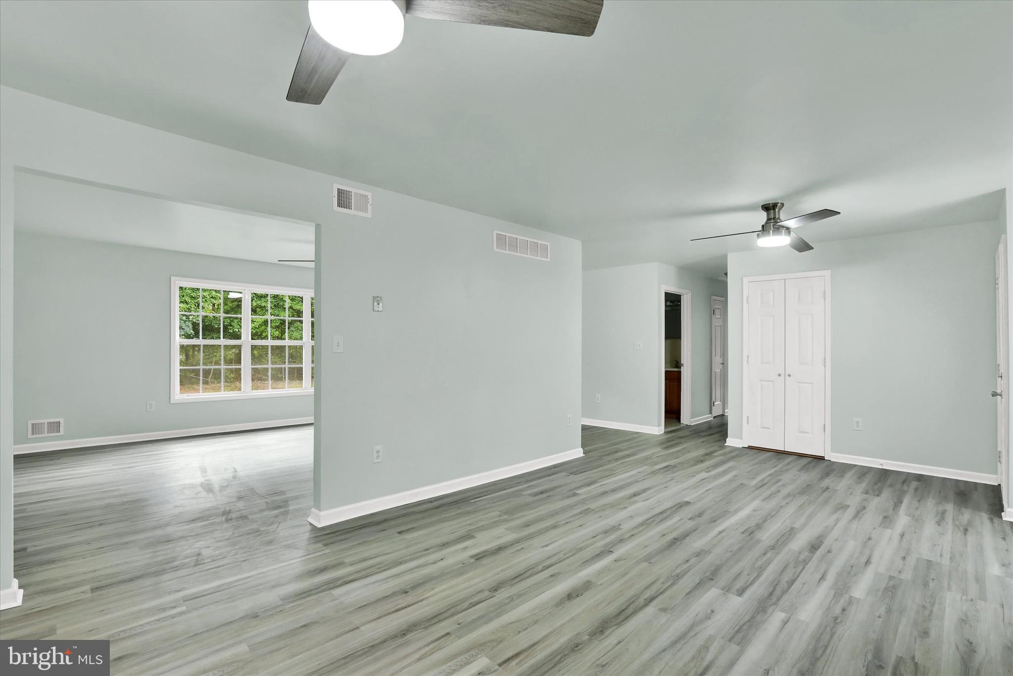 77 Hockamick Road Cookstown, NJ 08511 - Photo 7 of 25 a view of an empty room with wooden floor and a window