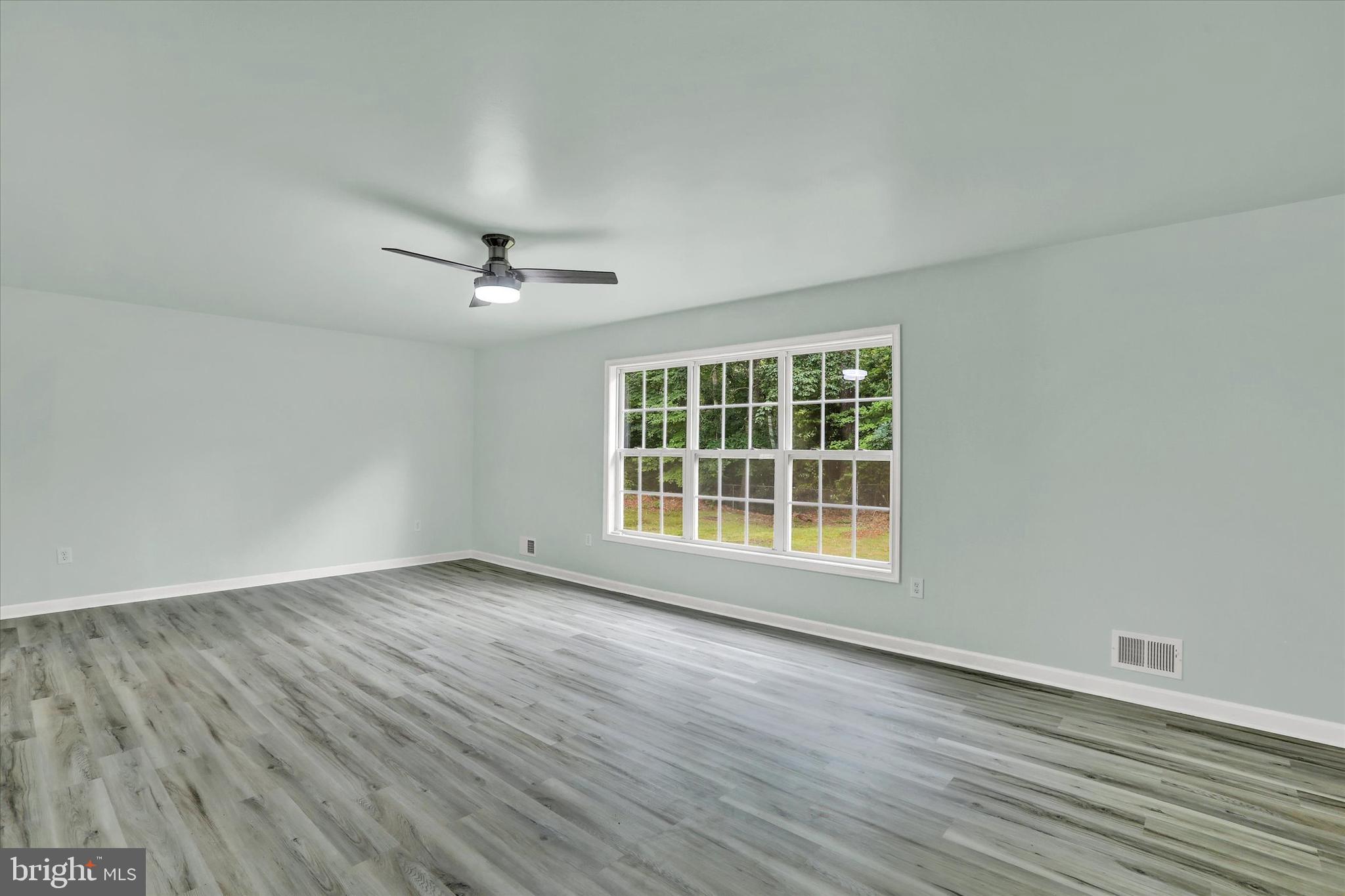 77 Hockamick Road Cookstown, NJ 08511 - Photo 8 of 25 a view of an empty room with wooden floor and a window