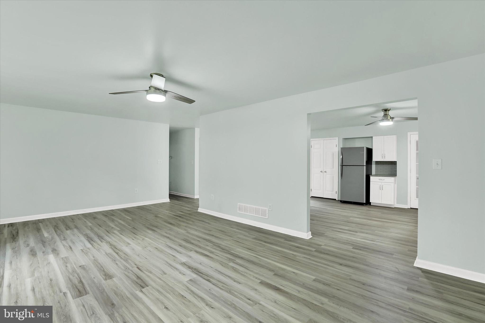 77 Hockamick Road Cookstown, NJ 08511 - Photo 10 of 25 a view of an empty room with wooden floor ceiling fan