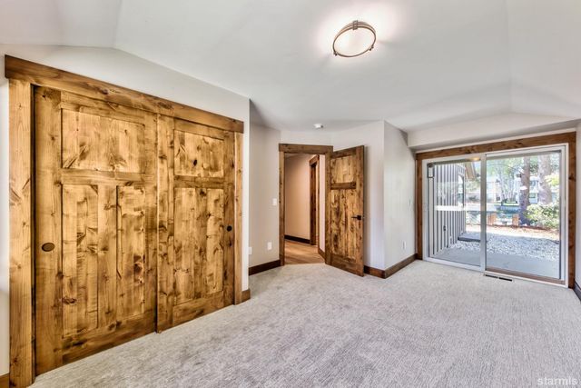 a view of swimming pool with outdoor seating and lake view
