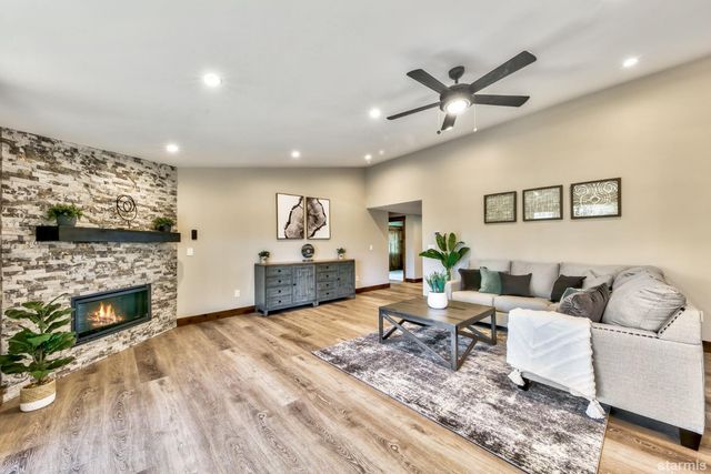 a living room with furniture and fireplace