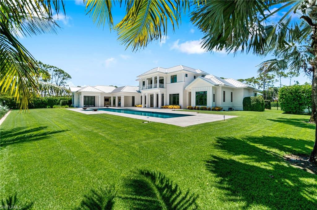 171 North Street Naples, FL 34108 - Photo 40 of 50 View of pool with a patio and a lawn