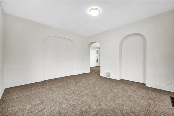 an empty room with a door