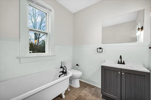 a bathroom with a sink a toilet and a bathtub