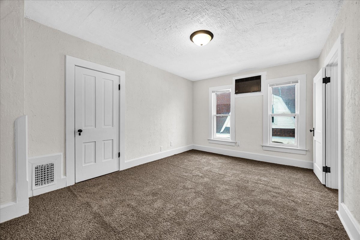 449 North 3rd Avenue Canton, IL 61520 - Photo 17 of 28 an empty room with windows and closet