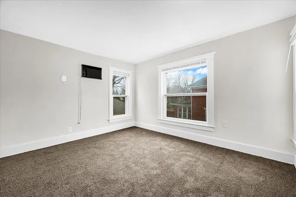 an empty room with windows