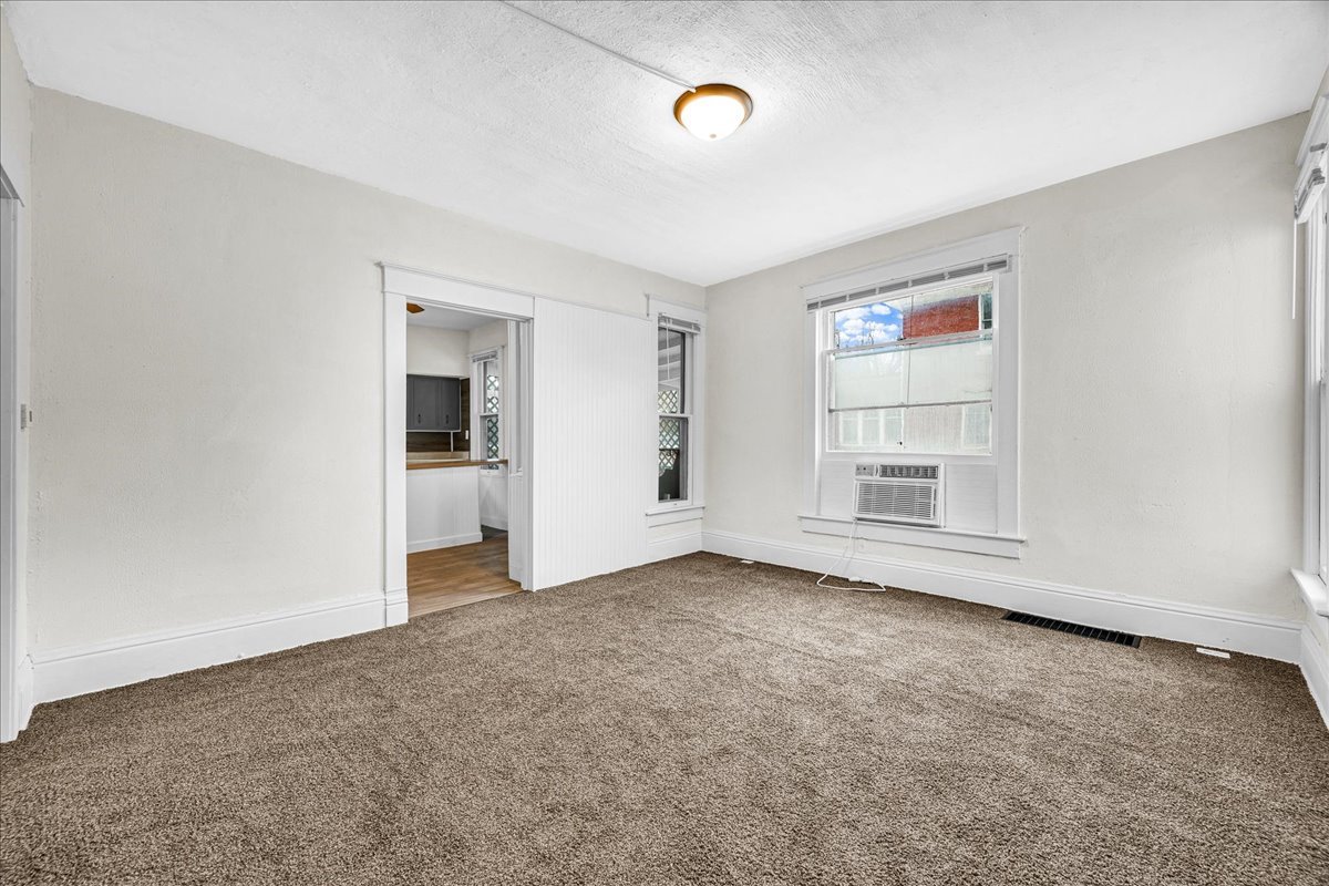 449 North 3rd Avenue Canton, IL 61520 - Photo 4 of 28 an empty room with windows