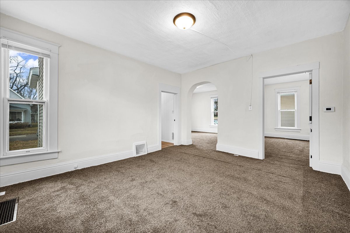 449 North 3rd Avenue Canton, IL 61520 - Photo 5 of 28 an empty room with windows and closet
