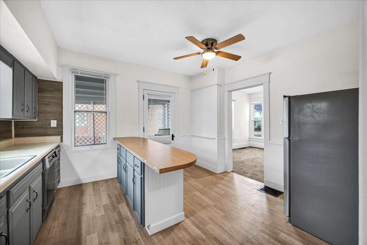 449 North 3rd Avenue Canton, IL 61520 - Photo 8 of 28 a kitchen with a refrigerator and a sink