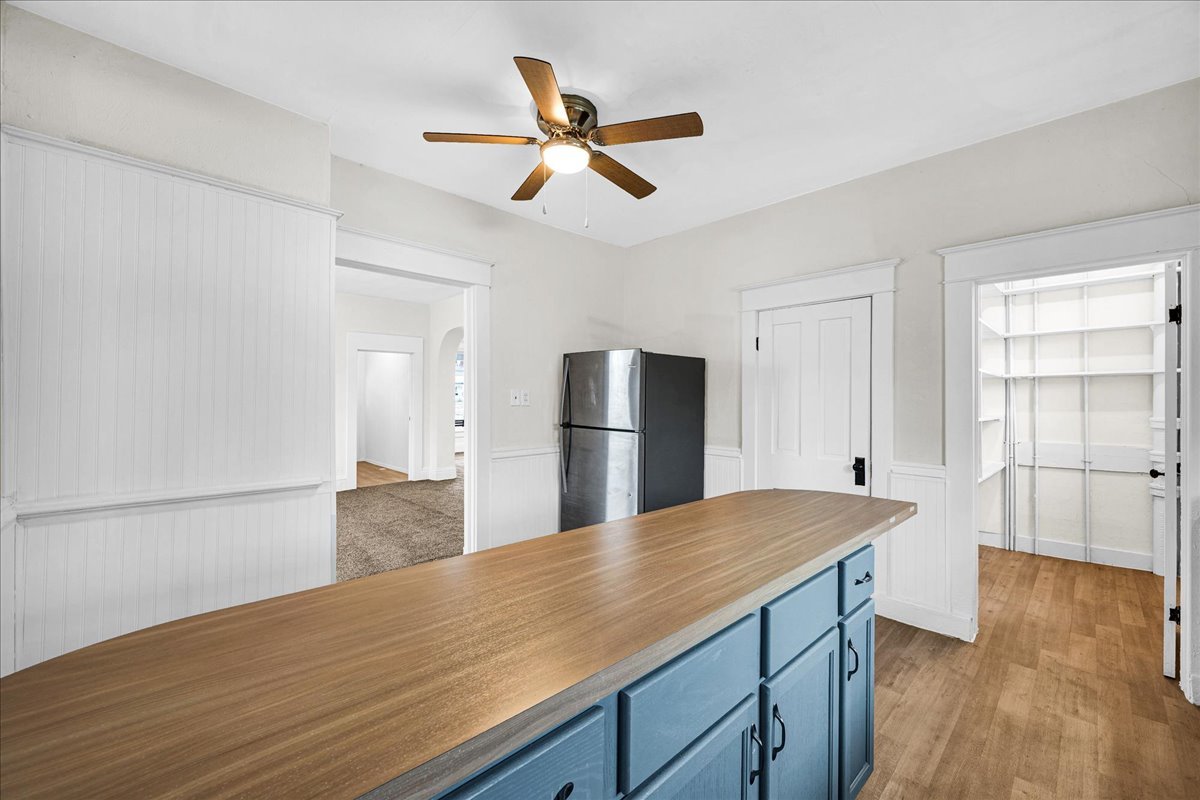 449 North 3rd Avenue Canton, IL 61520 - Photo 9 of 28 a view of kitchen and empty room with wooden floor