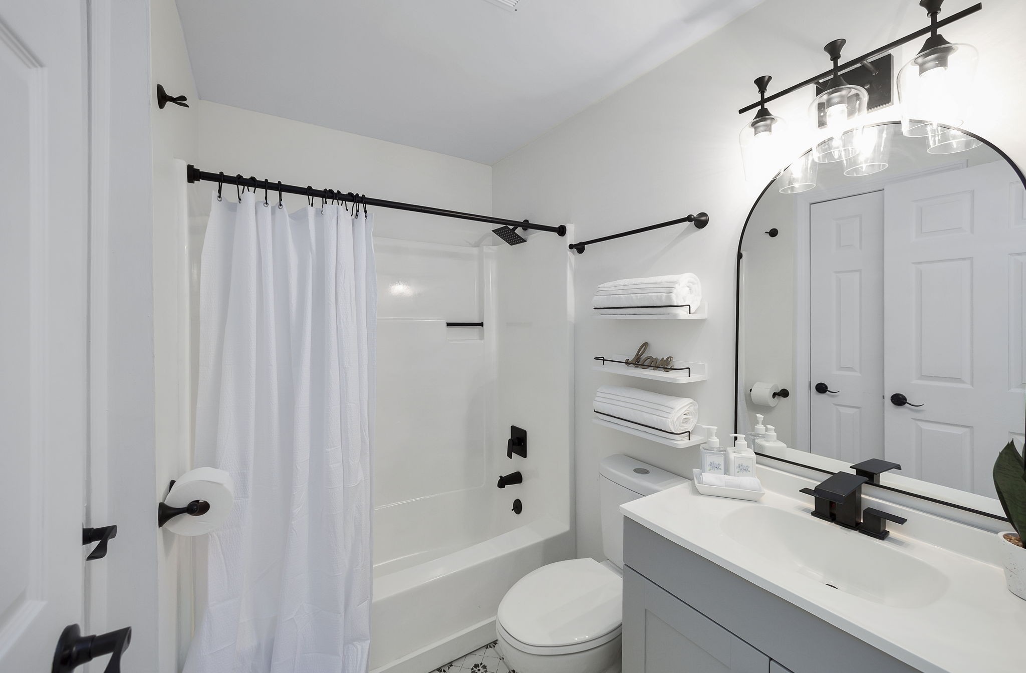 5 Raintree Cove Jackson, TN 38305 - Photo 12 of 25 a bathroom with a sink a toilet and shower