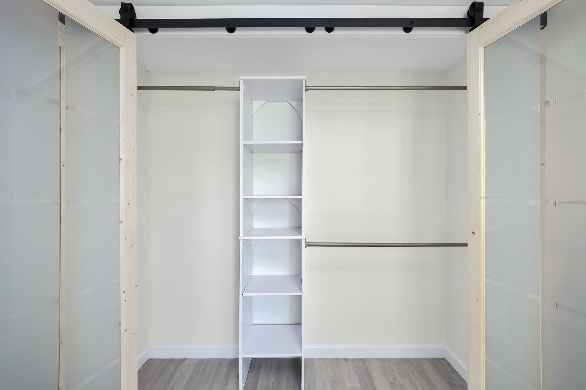 5 Raintree Cove Jackson, TN 38305 - Photo 15 of 25 a walk in closet with wooden floor