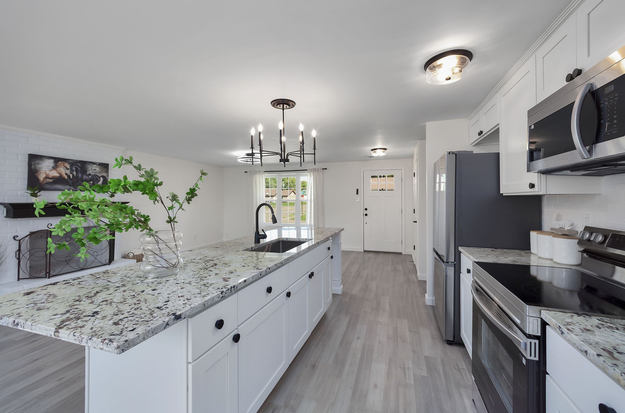 5 Raintree Cove Jackson, TN 38305 - Photo 2 of 25 a kitchen with stainless steel appliances granite countertop a sink stove and refrigerator