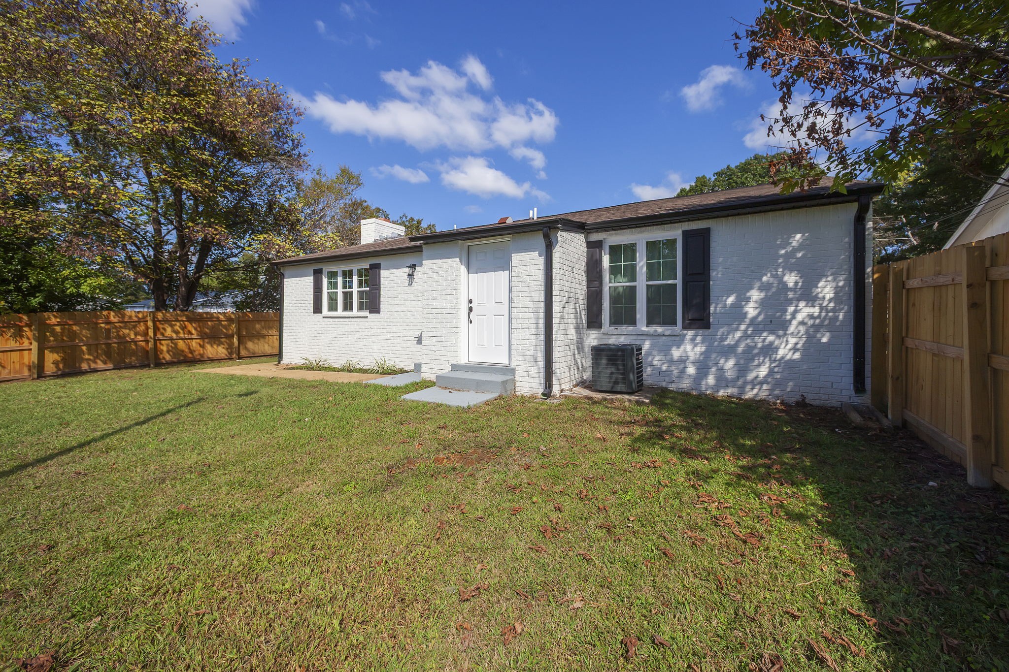 5 Raintree Cove Jackson, TN 38305 - Photo 23 of 25 a view of a house with backyard and garden