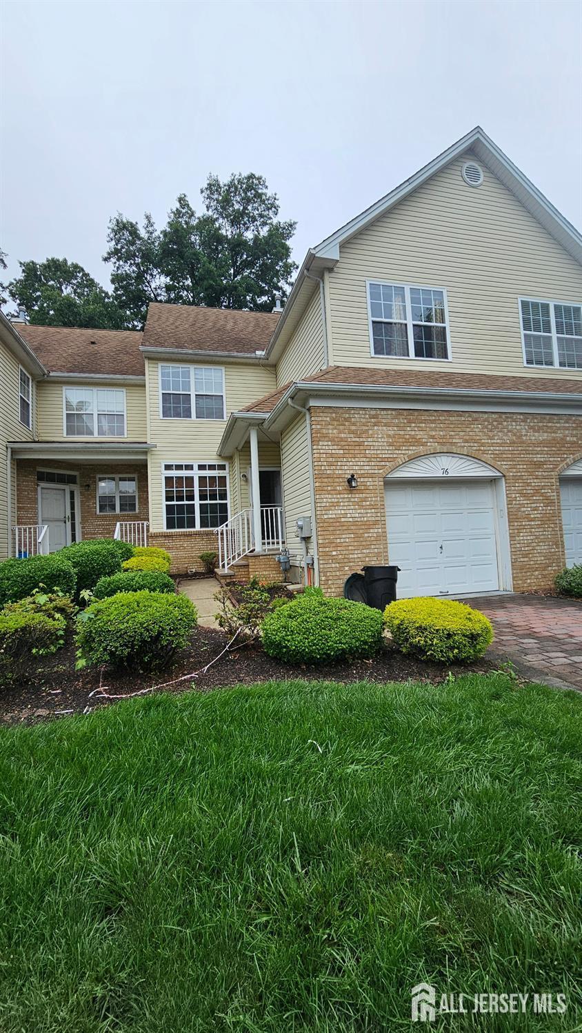 11 Tennyson Road East Windsor, NJ 08520 - Photo 2 of 2 a front view of a house with a yard and garage
